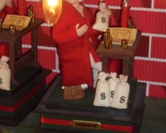 2 - Scrooge at table w/money bags