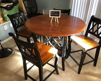 Solid wood bar height bistro set $250
The base also holds wine bottles
