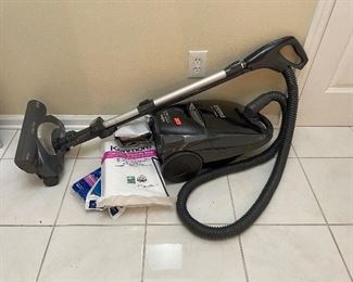 Canister vacuum with attachments and bags