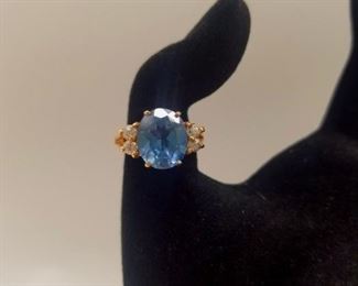AVAILABLE FOR PRESALE. Synthetic Large blue stone, 4 cubic zirconium. 10kGold band. $299
