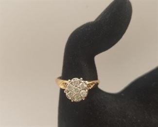 7 stone round diamond cluster /2 small diamonds in band . Approx. 1/2 ct. 14k gold.