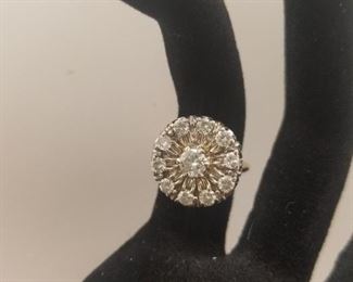 AVAILABLE FOR PRESALE. Large round cluster ring with 10 round outside diamonds and 1 5.5 mm center diamond. Total approx. 1.50 ct. 14k stamp.