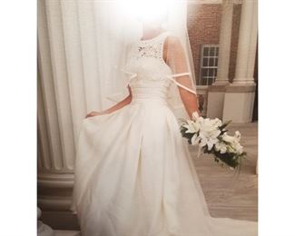 Italian made Wedding Dress. Dimension: 36" bust, 27" waist, 14" waist to collar, 37" bottom of waist to floor, 18" train.