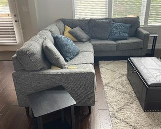 Zardoni 3-Piece Sectional , includes right-arm facing sofa w/ corner wedge, left-arm facing loveseat.  Modern nostalgia in charcoal gray w. classic tufted back cushions. 