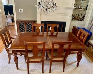 Dining room table and 10 chairs and 2 leaves