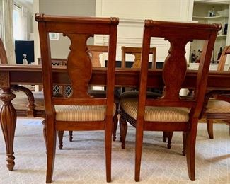 Dining room table and 10 chairs and 2 leaves