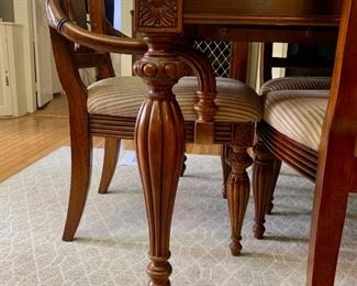 Dining room table and 10 chairs and 2 leaves