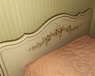 One of the twin beds in the girls daisy room.