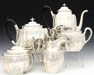 A 20th century Gorham Sterling Silver tea set retailed by Hodgson Kennard & Co. Includes a coffee pot, teapot, sugar, creamer and waste bowl. Impressed marks. 77.81 troy ozs total weight. Monogrammed, minor surface wear. 4 1/2 to 9" high. ESTIMATE $1,500-2,500