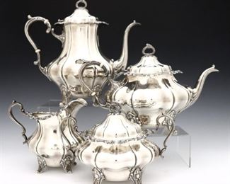 A 20th century Gorham "Strasbourg" pattern Sterling Silver tea set. Includes a coffee pot, teapot, sugar and creamer. Impressed marks. 82.96 troy ozs total weight. Minor surface wear, two small dents to coffee pot. 5 1/2 to 9 1/2" high. ESTIMATE $1,500-2,500