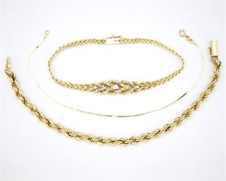 Three 14k Gold bracelets, one with Diamond accents. Impressed marks. 12.6 grams total weight. Minor surface wear, thinnest with kinks and broken clasp. Up to 7 1/2" long. ESTIMATE $200-300