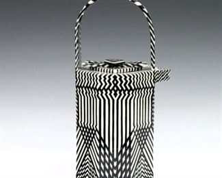 Kathryn Sharbaugh, American, b. 1948. A late 20th century Art Pottery teapot with octagonal form and Black and White Op Art decoration. Unsigned, minor wear with some crazing, glued repair at lid. 5 1/2 x 4 1/2 x 10 1/4" high overall. ESTIMATE $200-400