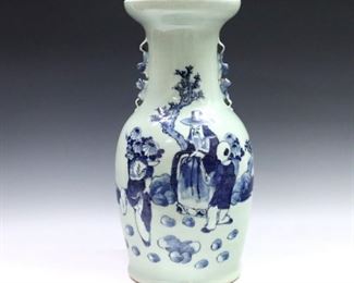A Chinese Blue and Celadon porcelain vase. Baluster form vessel with double Foo Dog handles and hand-painted decoration depicting a scholar seated in a garden with two attendants. Unmarked, minor wear with hairlines to glaze only at base. 16 1/2" high. ESTIMATE $200-300