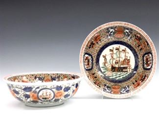 A pair of Japanese Export Imari "Black Ship" pattern porcelain bowls. Round forms with hand-painted decoration depicting a central "Black Ship" surrounded by alternating vignettes of Dutchmen, floral crests and trading ships. Unmarked, minor wear to decoration. Each 9 3/4" diameter and 3 1/4" high. ESTIMATE $800-1,200 pr