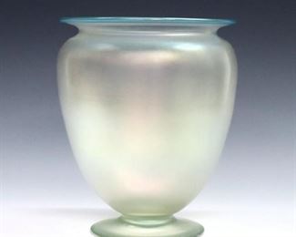 An early 20th century Steuben Verre de Soie vase with Celeste Blue trim. Shape #938, bulbous form with flared lip and foot. Unmarked, minor surface wear. 7" diameter and 8 1/2" high. ESTIMATE $400-600