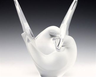 A mid 20th century Lalique "Sylvie" pattern Crystal vase. Lovebird dove forms with frosted exterior and flower frog insert. Etched "Lalique France" signature. Slight surface wear. 8 1/4" high. ESTIMATE $400-600