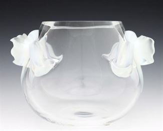 A late 20th century Lalique "Orchidee" pattern Crystal vase. Clear bulbous form with two orchid form opalescent glass handles. Etched "Lalique France" signature. Minor wear, 3/8" shallow chip to one petal. 7" diameter and 6" high. ESTIMATE $400-600