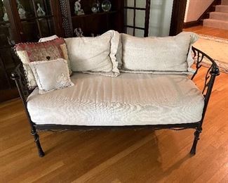 beautiful wrought iron loveseat with curved backs, cushions (with zippers & need cleaning) and faux bois vine design