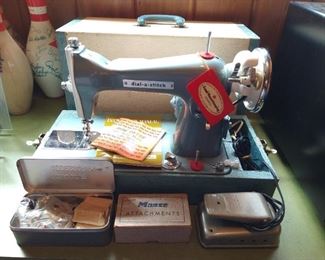 Vintage Dial-a-Stitch sewing machine in excellent condition with case, manuals, and accessories!