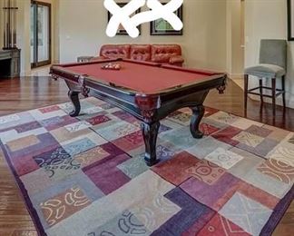Pool table.  Is that another sleeper sofa??  Yes it is. :)  There are 2 of the barstools pictured. Fun rug.