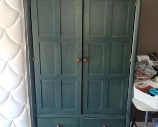 Green wood storage cabinet from Marshall Field's. Photo of matching dresser and night stand to come