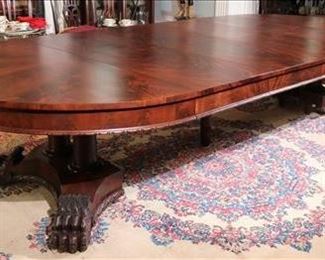 078 - Mahogany Empire banquet dining table, base with double pedestals and large claw feet, has 6 matched veneer leaves, makes over 15 ft. L, 29 in. T, 60 in . W.