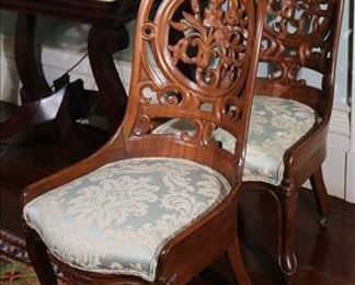 116 - Pair of walnut Victorian pierce carved parlor chairs, Meeks style with blue upholstery, 38 in T, 16 in. W, 18 in. D.