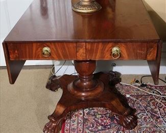 144 - Empire drop leaf table with claw feet, 2 drawers and brass pulls, 29 in. T, 30 in. w, 32 in. L.