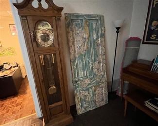 Wonderful grandfather clock and a…
 A door; uh, If your house is missing a door and has been for like 60 years then I guess this could be it.