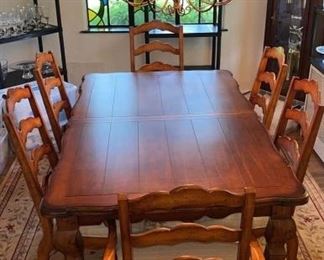 Solid wood dining table with two leaves and 10 chairs excellent condition by Universal furniture/Levin furniture