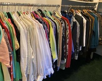 Walk-in closet full of women’s clothing mostly size medium and large