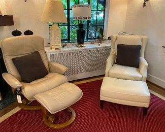 Stressless Ekornes chair and Ottoman on the left and ARHAUS leather chair and ottoman on the right