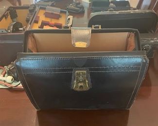 Collection of antique medical bags and equipment 