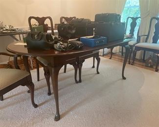 Cherry table measures 63" long without leaves and each leaf is 12" 