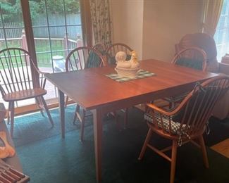 Cherry dining table with (6) Windsor chairs and (2) leaves. Purchased from Hope Farm Furniture