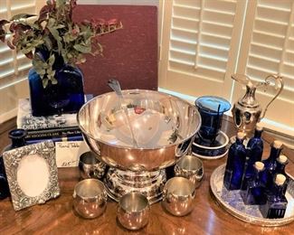 Silverplate punch bowl and cups; blue bottles