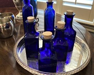 Blue bottles; small silverplate tray