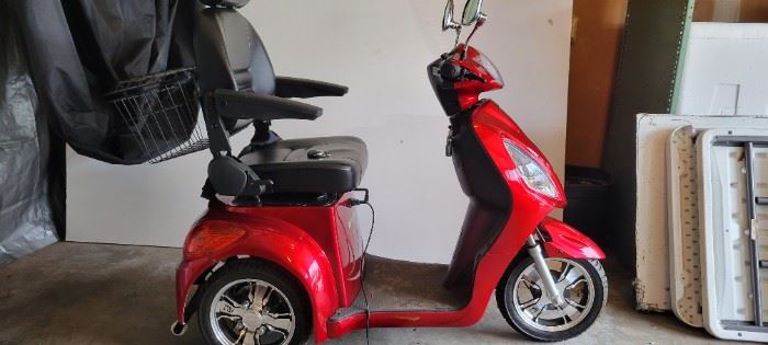 Like new condition 2018 E Wheels Power Scooter with cover and charger. New batteries 