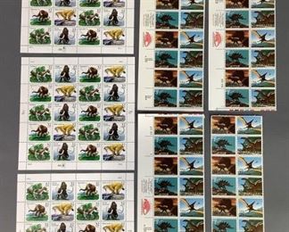 Four blocks of sixteen (16) each and twelve (12) additional 1989 Dinosaur MNH stamps, Scott #2422-2425. Three blocks of twenty (20) each of 1996 Mammoth MNH stamps, Scott #3077-3080.