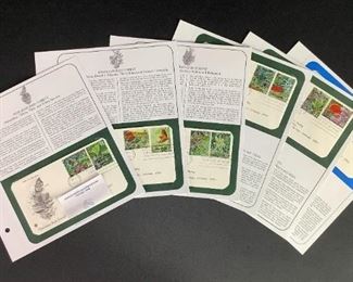Hawaiian rainforest first day issue post marked stamps and description pages. Includes five pages with two (2) stamps each of Hawaiian rainforest species and plant stamps, as well as one page with one (1) Hawaii Statehood stamp.