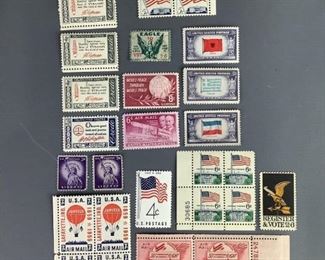 Wright Brothers, World Peace, & More Assorted MNH stamps. One (1) 1968 Register and Vote, Scott #1344. One (1) 1959 World Peace, Scott #1129. Three (3) 1943 Overrun Countries Alabama, Yugoslavia, and Greece, Scott #918, 917, 916. Seven (7) 1960 American Credo, Scott #1139, 42-44. One (1) 1960 US Flag, Scott #1153. Two (2) 1963 US Flag and Cap, Scott #1208. Ten (10) 1968 US Flag and Capitol, Scott #1338. Four (4) 1953 50th Anniversary of Powered Flight, Scott #047. One (1) 1949 Wright Brothers, Scott #C45. One (1) 1960's Vintage Eagle stamp. Two (2) 1956 Purple Liberty, Scott #1035. Four (4) 1959 Jupiter Balloon, Scott #C54.