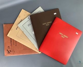 Two (2) mint sheet files with plastic cover, one red and one brown. Three paper bak mint sheet files, one Gimbels brand. Some wear to paper covers.
