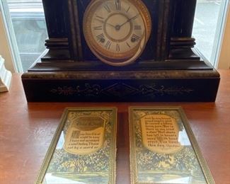 Antique black slate empire mantle clock.