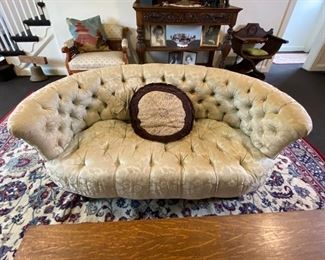 Tufted Victorian settee.