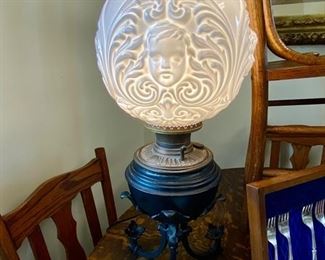 Gone With The Wind lamp with large, blown-out milk glass cherub shade.