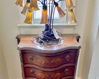 Reproduction Tiffany Lily favrile table lamp & French-style inlay kingwood small chest.