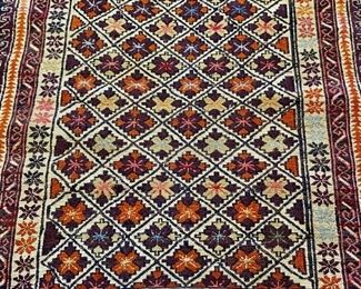 Hand-knotted wool Afghan rug.