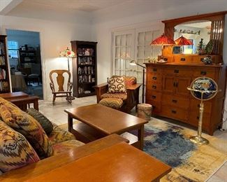 Looking into the sun room showing the Arts and Craft style furniture, stained glass lighting and a fabulous globe