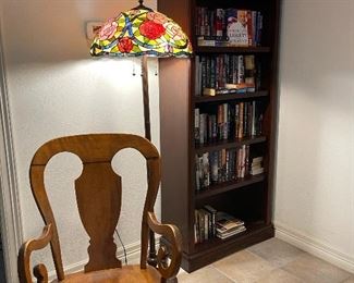 Antique rocking chair, and the second bookcase. Book collection are political, travel and novels.  The most beautiful stained glass floor lamp.