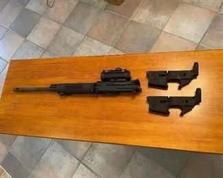 Here we have a 450 Bushmaster upper receiver that fits the AR15. This gives you the extra punch needed for hunting hogs. The two AR15 lower receivers are Smith & Wesson brand still in the box. The lower receivers are what you start with when you want to build your own AR15. They have the registered serial # on them.